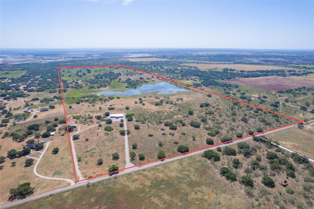 aerial view with a rural view and a water view