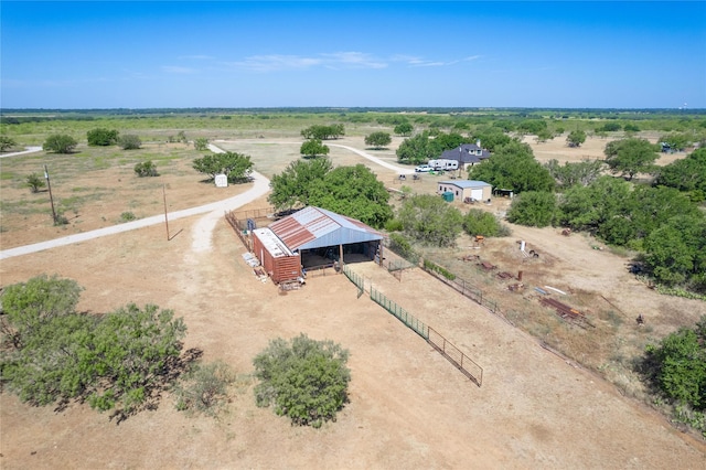 birds eye view of property with a rural view