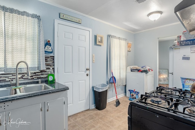 kitchen featuring white cabinets, ornamental molding, sink, tasteful backsplash, and white fridge