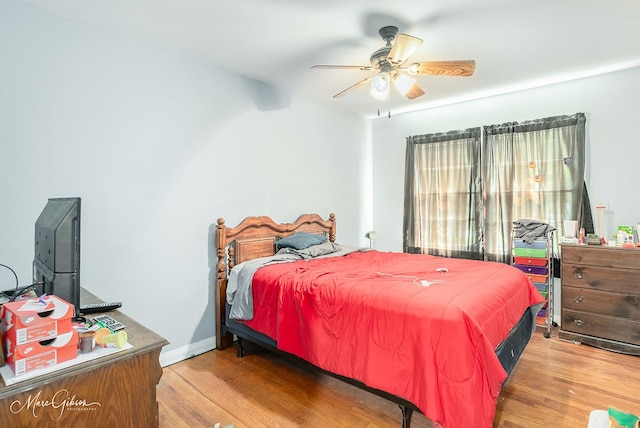 bedroom featuring wood-type flooring and ceiling fan