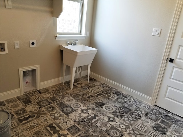 clothes washing area with hookup for an electric dryer, dark tile patterned floors, and hookup for a washing machine