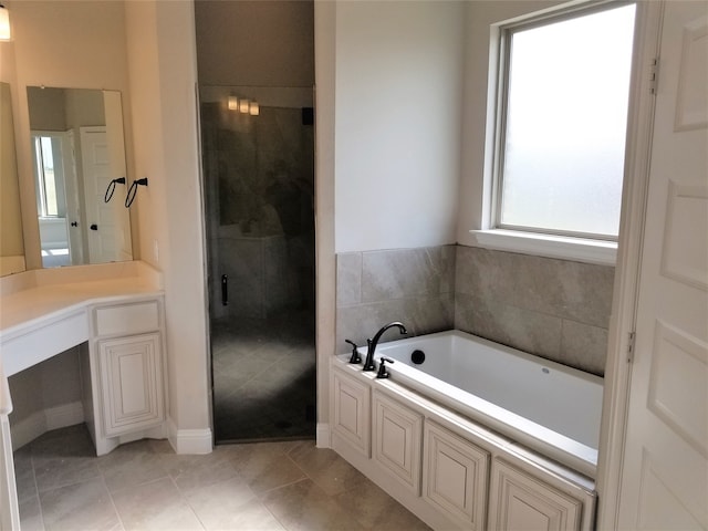 bathroom with tile patterned flooring, vanity, and independent shower and bath