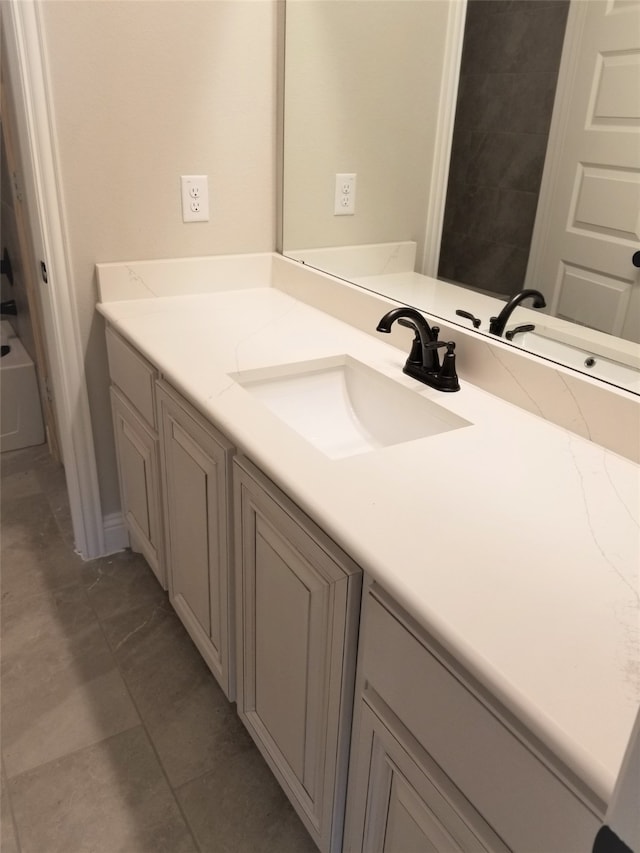 bathroom featuring tile patterned floors, vanity, and  shower combination