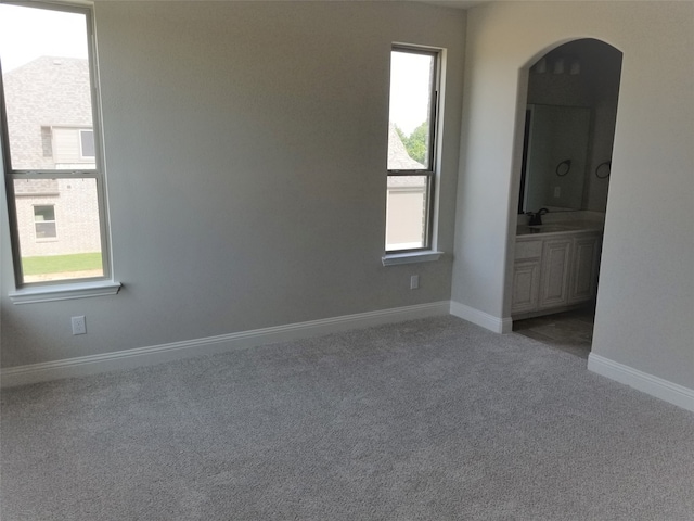 carpeted empty room with sink