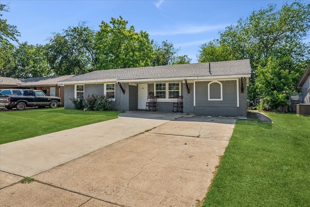 single story home featuring a front lawn and a porch