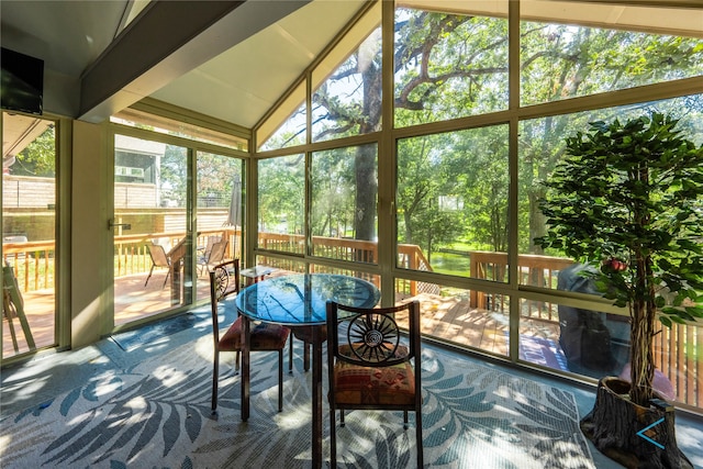 sunroom featuring lofted ceiling