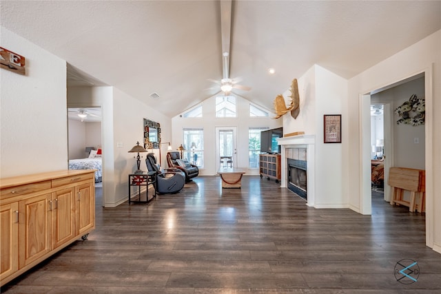 living room with ceiling fan, dark wood-type flooring, and lofted ceiling with beams