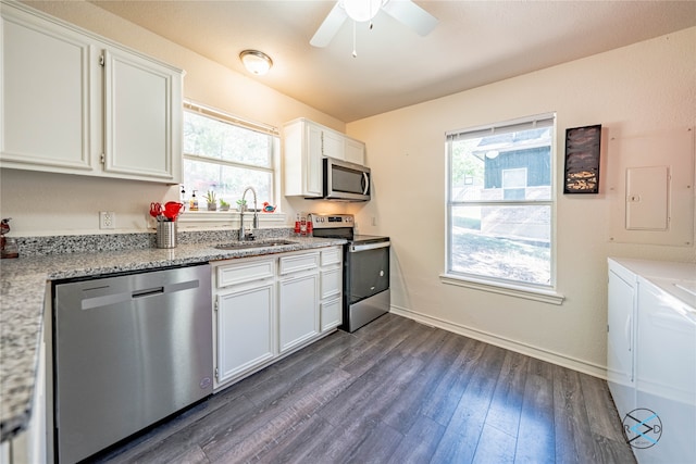 kitchen featuring white cabinets, ceiling fan, dark wood-type flooring, and stainless steel appliances