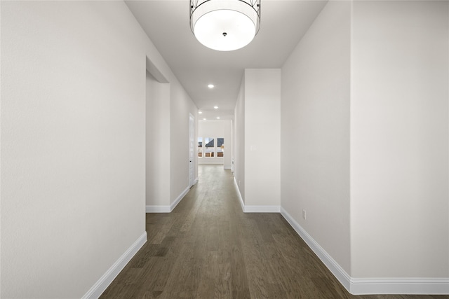 hall with dark wood-type flooring