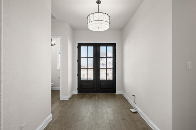 entryway featuring french doors and dark hardwood / wood-style floors