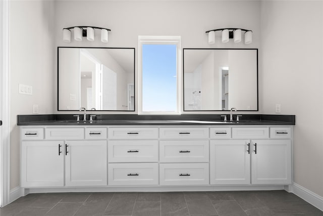 bathroom featuring tile patterned floors and vanity