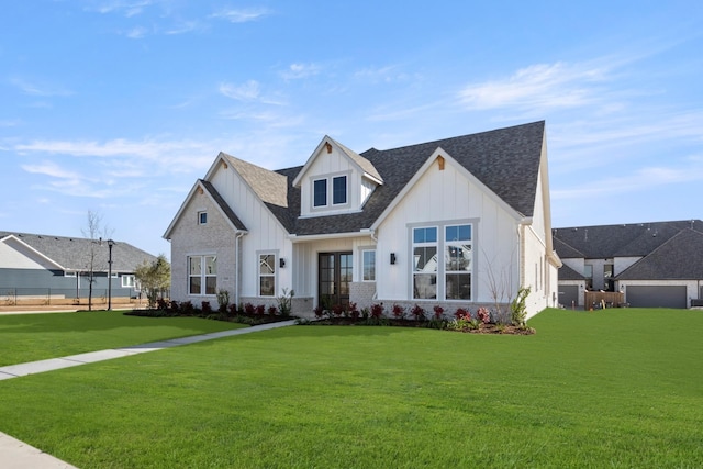 modern farmhouse style home with a front lawn