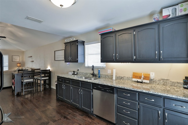 kitchen with dark wood-type flooring, light stone countertops, dishwasher, and sink