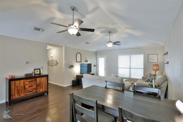 dining space featuring dark hardwood / wood-style flooring, ceiling fan, and lofted ceiling