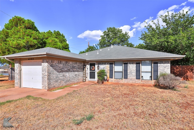 single story home featuring a garage