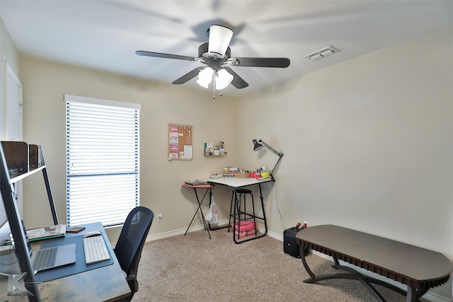 office featuring ceiling fan and light carpet