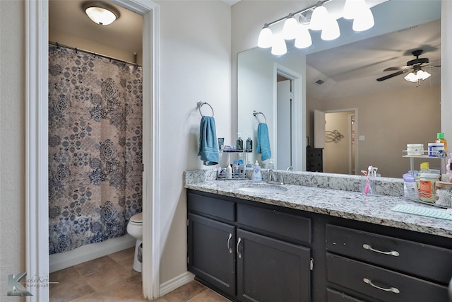 bathroom with vanity, toilet, walk in shower, and ceiling fan