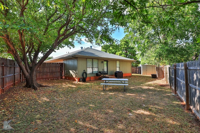 back of property with a storage unit