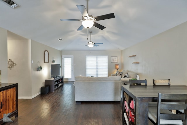 living room featuring lofted ceiling, ceiling fan, and dark hardwood / wood-style floors