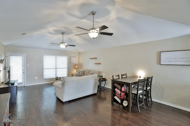 living room featuring dark wood-type flooring, lofted ceiling, and ceiling fan