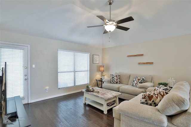 living room with ceiling fan, dark hardwood / wood-style flooring, and vaulted ceiling