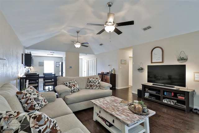 living room featuring vaulted ceiling, dark hardwood / wood-style flooring, and ceiling fan