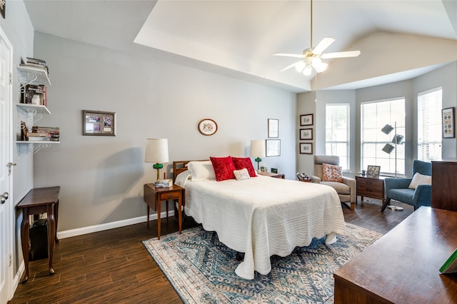 bedroom featuring ceiling fan, lofted ceiling, and dark hardwood / wood-style floors