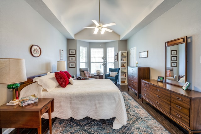 bedroom with ceiling fan, lofted ceiling, and dark hardwood / wood-style floors