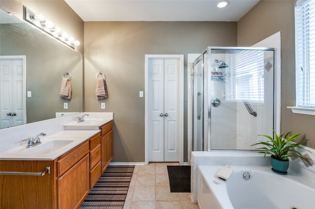 bathroom featuring vanity, plus walk in shower, and tile patterned flooring