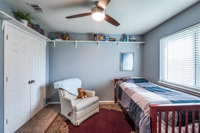 carpeted bedroom with ceiling fan