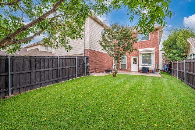 back of property featuring a lawn and a patio area