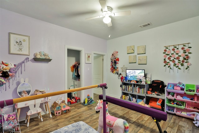 rec room featuring wood-type flooring and ceiling fan