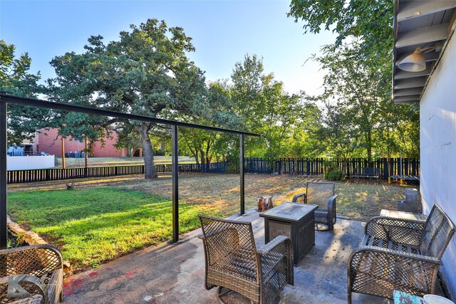 view of patio / terrace with an outdoor fire pit