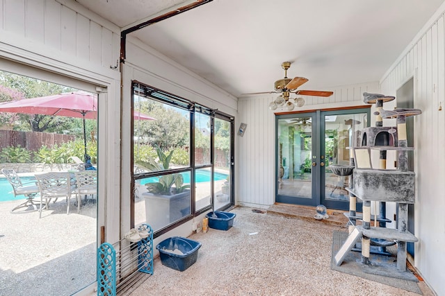 interior space with ceiling fan