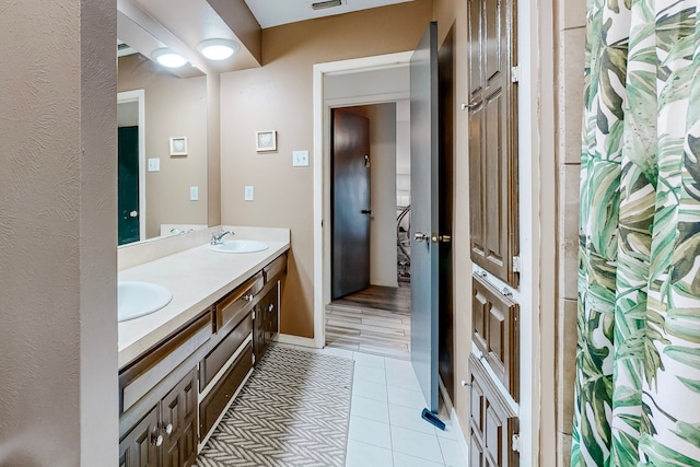 bathroom featuring vanity and tile patterned floors