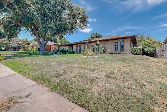 ranch-style home with a front yard