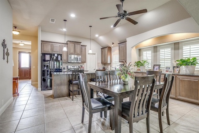 dining area with light tile patterned flooring, ceiling fan, and a healthy amount of sunlight