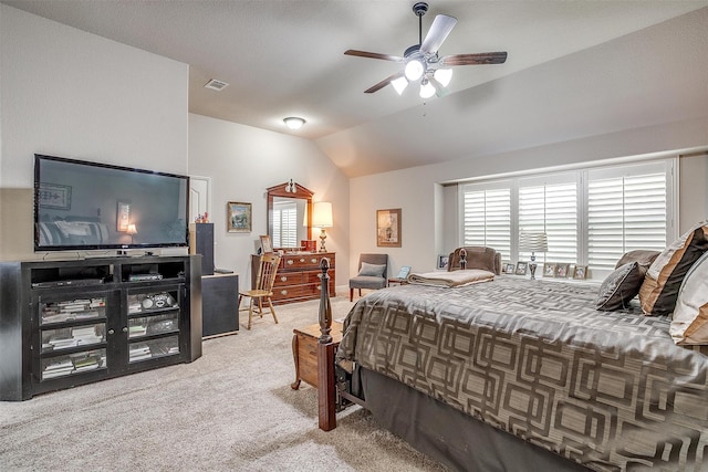 carpeted bedroom with ceiling fan and lofted ceiling