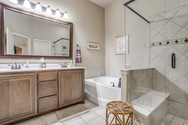 bathroom with shower with separate bathtub, dual bowl vanity, and tile patterned flooring