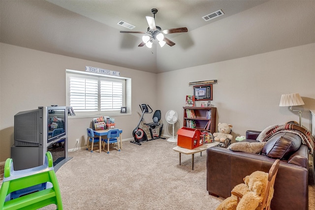 playroom featuring ceiling fan, light colored carpet, and lofted ceiling