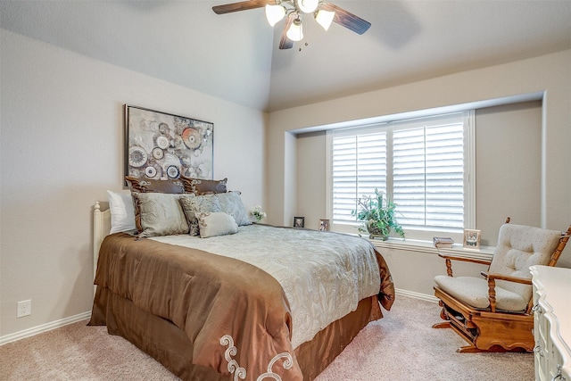 bedroom with ceiling fan, light carpet, and lofted ceiling