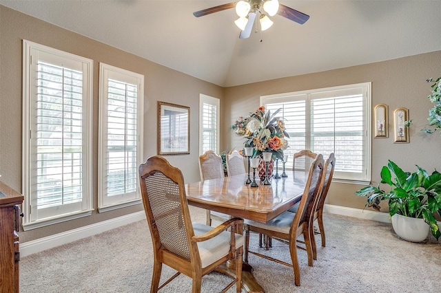 dining area with ceiling fan, carpet, and lofted ceiling