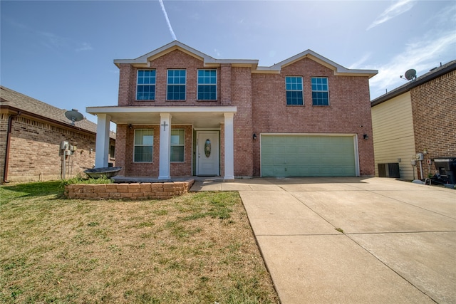 view of front of house featuring a garage and a front lawn