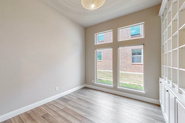 spare room featuring light hardwood / wood-style flooring