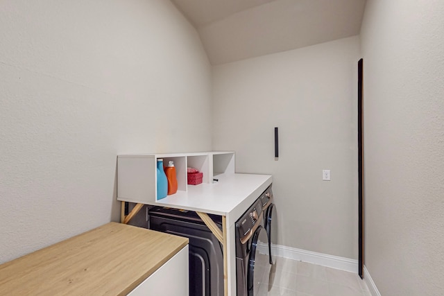 washroom featuring light tile patterned floors and washer / dryer