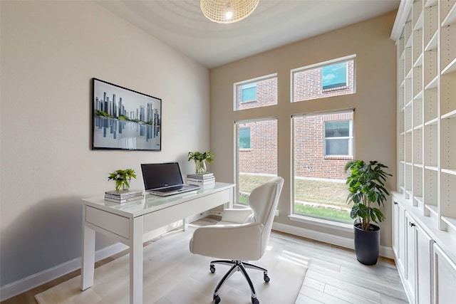 office space featuring light wood-type flooring