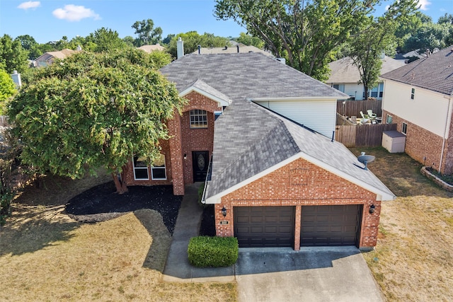 view of front of home featuring a garage and a front yard