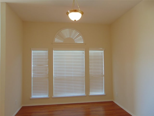 interior details with wood-type flooring and a wealth of natural light