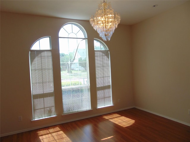 interior space featuring wood-type flooring and a chandelier