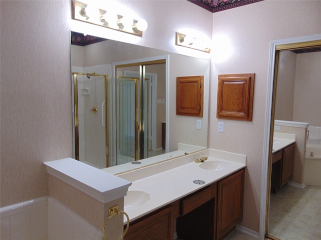 bathroom with tile patterned flooring, double sink vanity, and an enclosed shower